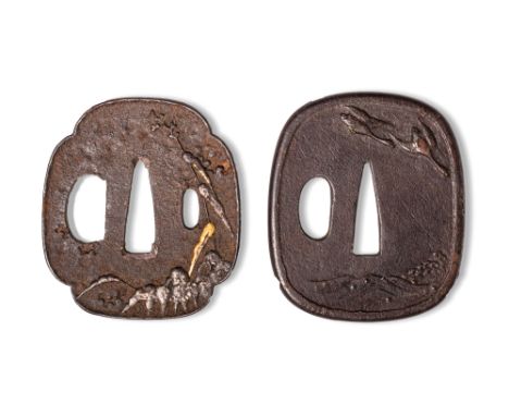 Momoyama - Edo Period, Ca. AD 1573 - 1868. A pair of tsuba comprising a mokko-shaped iron tsuba, decorated in relief with a l