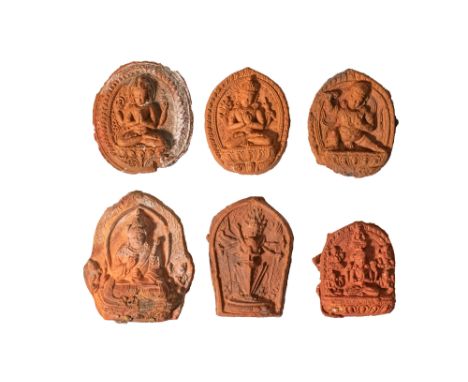Ca. AD 1300 - 1800. A group of six moulded clay votive plaques (tsha tsha), each impressed with Buddhist deities and ritual f