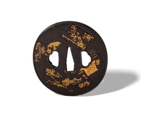 Edo Period, Ca. AD 1603 - 1868. A finely crafted round iron tsuba featuring multiple book motifs inlaid with gold. Each book 