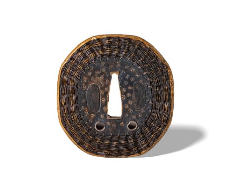 Edo Period, Ca. AD 1603 - 1868. An iron tsuba of rounded octagonal form, featuring a finely rendered woven motif along the ri