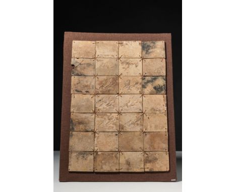 Han Dynasty, Ca. 206 BC - AD 220. A panel composed of twenty-four ancient Chinese glass tiles, each of rectangular form, arra