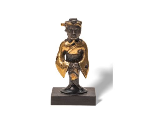 Warring States Period to Qin Dynasty, Ca. 221 - 207 BC. A rare figure cast in silver overlaid in gold sheet, in a stylised up