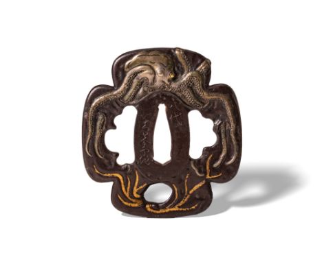 Edo Period, Ca. AD 1603 - 1868. An iron tsuba of mokko form, finely detailed with a depiction of an octopus stretching its te