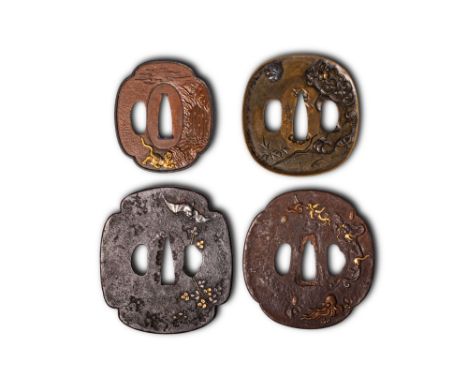 Edo Period, Ca. AD 1603 - 1868. A set of tsuba comprising one with a tiger by a waterfall in relief and gilt highlights; the 