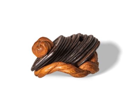 Edo Period, Ca. AD 1603 - 1868. A wood carved netsuke in the form of a string of coins. Size: 40mm x 35mm; Weight: 12g. Prove
