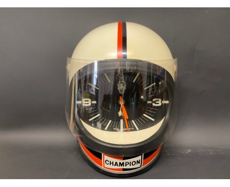 A rare Champion wall clock in the form of a racing helmet, in very good condition.