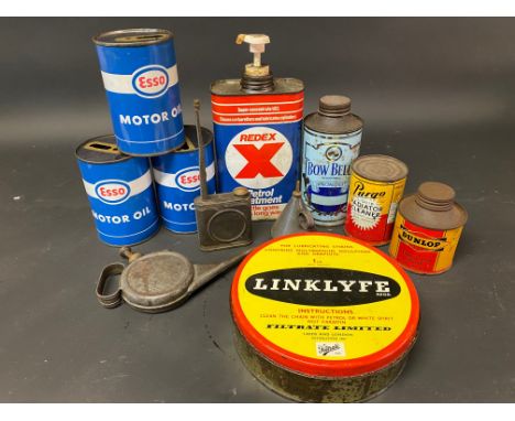 A selection of assorted oil and other cans including Dunlop and Bow Bells.