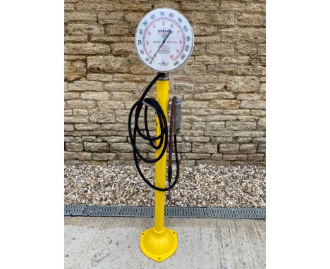 A Dunlop garage forecourt air and water meter, with a circular gauge and air line fittings.