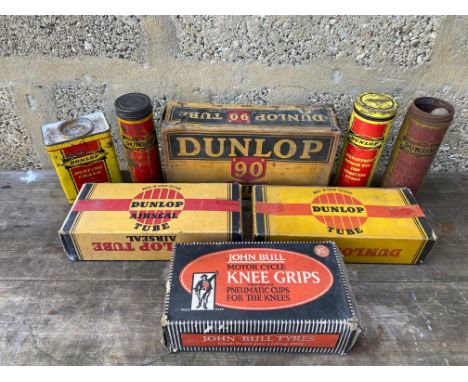 A quantity of Dunlop and John Bull packaging and tins.
