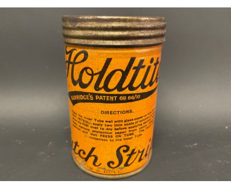 A Holdtite Patch Strip cylindrical tin in good condition, still with contents.