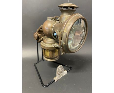 A Lucas 1910 King of the Road lamp on sales stand.