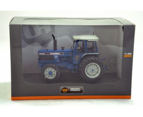 UH 1/32 Ford TW 35 Tractor.  Looks to be complete, excellent and with original box/boxes.