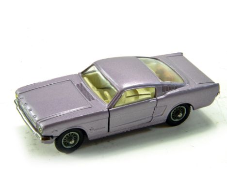 Corgi No. 320 Ford Mustang Fastback with Metallic light purple body, off-white interior and wire wheels. Lovely example is ex
