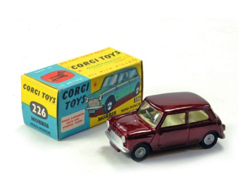 Corgi No. 226 Morris Mini Minor in metallic maroon, lemon interior, silver trim and cast wheel. Great example is excellent to