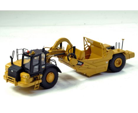 Diecast Masters 1/50 CAT 621K Wheel Tractor Scraper. Looks to be complete, excellent and with original box/boxes. - NOTE THIS