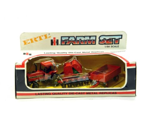 Ertl 1/64 Vintage International Tractor and Implement Set.  Looks to be near mint, likely to have not been previously unboxed
