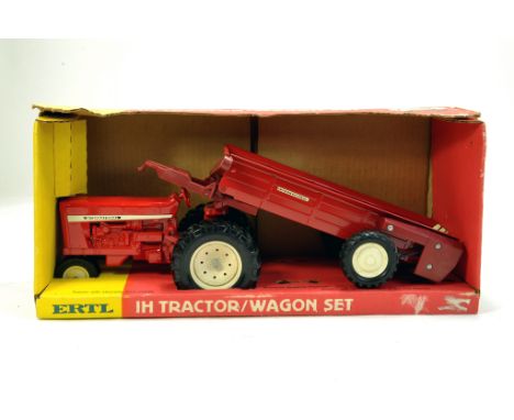 Ertl 1/16 International Tractor and Wagon Set however wagon is replaced with manure spreader.  Looks to be complete, excellen