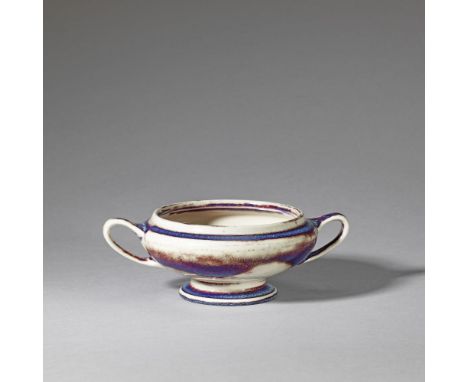 Ruskin PotteryTwin-handled footed porringer,  model no. 512, 1922Stoneware, mottled high-fired flambé glaze.9.4cm high, 23cm 