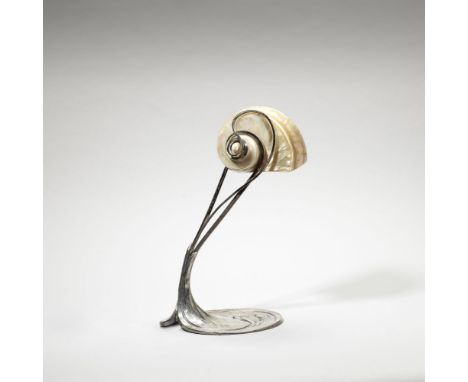 Moritz HackerArt Nouveau table lamp, circa 1900Plated metal, a large polished 'Turbo' shell forming the shade.35.5cm highStam