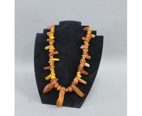 A vintage strand of Baltic amber beads, 65cm 