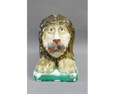 19th century Staffordshire sash window support, modelled  as a lion in coloured enamels, 12cm high