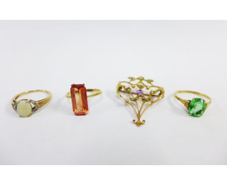 Three 9ct gold gemset rings and an unmarked gold openwork brooch with seed pearls and amethyst, (4) 