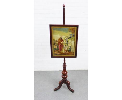Mahogany pole screen with a glazed wool work tapestry panel and on tripod legs, 171cm 
