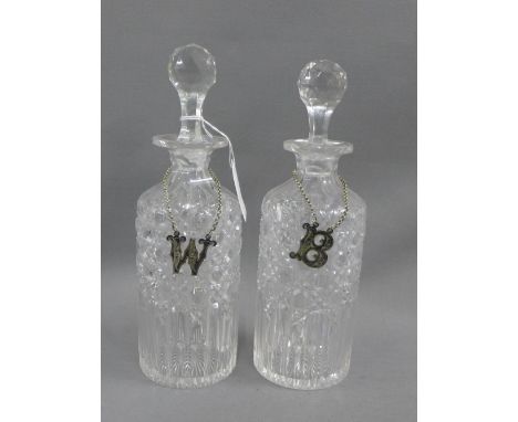 A pair of cut glass spirit decanter and stoppers, together with Epns W &amp; B decanter labels,  26cm high 