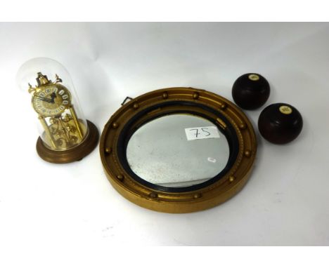 Gilt framed convex mirror, two old bowling balls, German anniversary clock and Victorian architectural slate mantle clock pre