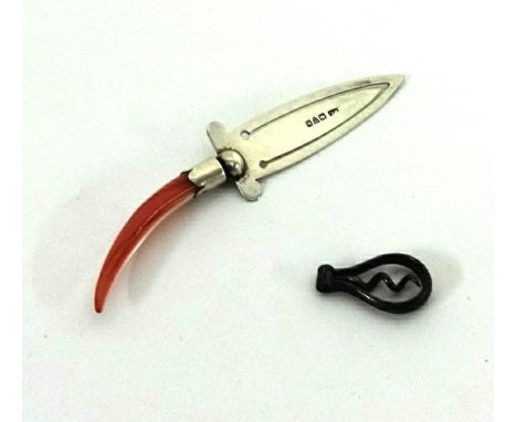 A silver and coral handle page marker and a miniature corkscrew.