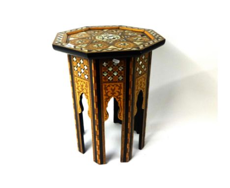 A Moroccan style occasional octagonal table with marquetry and mother of pearl decoration.