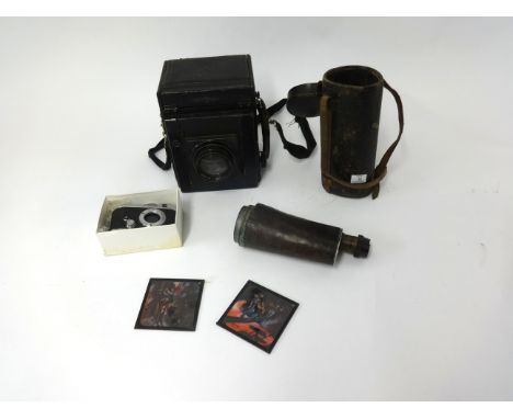 An assortment of cameras, binoculars etc including Junior Special antique camera, box of slides and also some magic lantern s