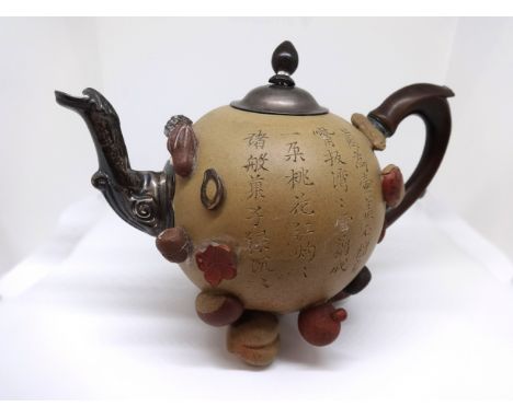 A Chinese Yixing teapot and cover 19th/20th Century of globular form applied with various nuts and seeds with white metal pos