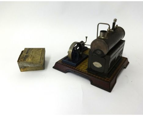 A German tin plate steam stationary engine by Gamage, London, boxed.