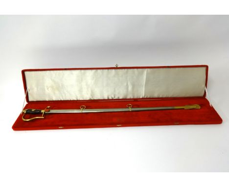 A mid 20th Century Turkish ceremonial sword and scabbard in red velvet case.