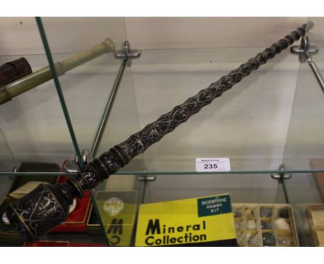 An Eastern inlaid hardwood swagger stick with brass ring mounts, 60cm