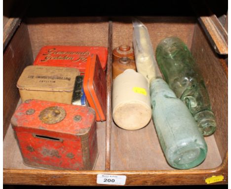 A selection of vintage tins and glass stoneware, bottles and jars 