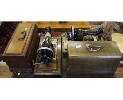 Two vintage sewing machines by Jones in carry case
