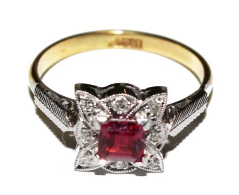 A diamond and faux ruby ring