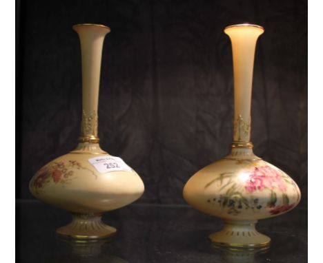 A pair of Royal Worcester pear-shaped ivory ground vases, puce 1748 marks