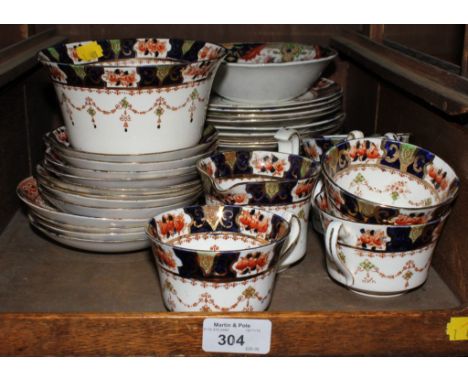 A Staffordshire tea service with navy blue and iron red border, thirty-eight pieces