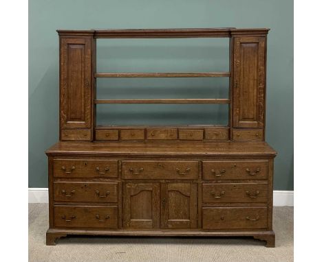 19TH CENTURY OAK WELSH DRESSER with open shelf rack, flanked by two cupboard doors, spice drawers, base with central cupboard