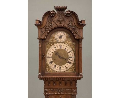20TH CENTURY WALNUT LONGCASE CLOCK with carving and relief, brass face, Westminster chime and pendulum (no weights), St Micha