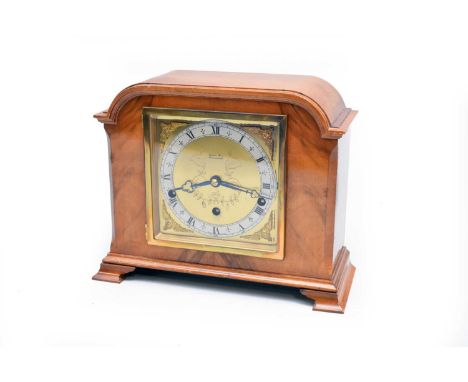 A walnut cased Elliott mantel clock for Charles Fox, Bournemouth, circa inter-war period, with arch-topped case, the brass di