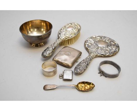 A small collection of silver, to include; a Victorian bowl, London 1872, 6cm high, a cigarette case, a vesta case, a napkin r
