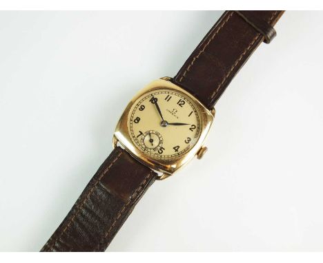 A Gentleman's gold plated Omega wristwatch, the cushion shaped case housing circular silvered dial with black Arabic numerals