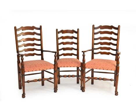 A set of ten (8+2) reproduction oak ladder-back dining chairs, the wavy ladder backs between turned uprights, stuff-over upho