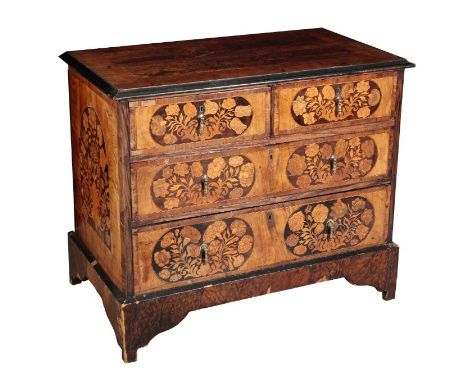 A DUTCH MARQUETRY CHEST OF DRAWERS Late 18th century, the rectangular top with quarter veneer and crossbanding, above two sho