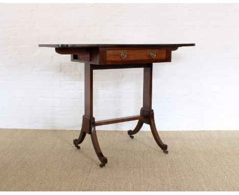 A Regency Mahogany Sofa Table A Regency Mahogany Sofa Table, early 19th century, with true and faux drawers, raised on stretc