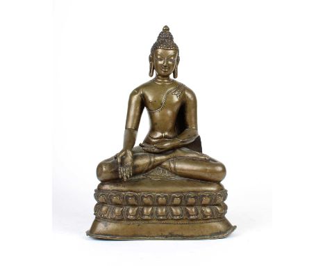 A 19th Century Thai Hollow Cast Bronze Buddha A 19th Century Thai Hollow Cast Bronze, modelled seated in varada mudra on a lo